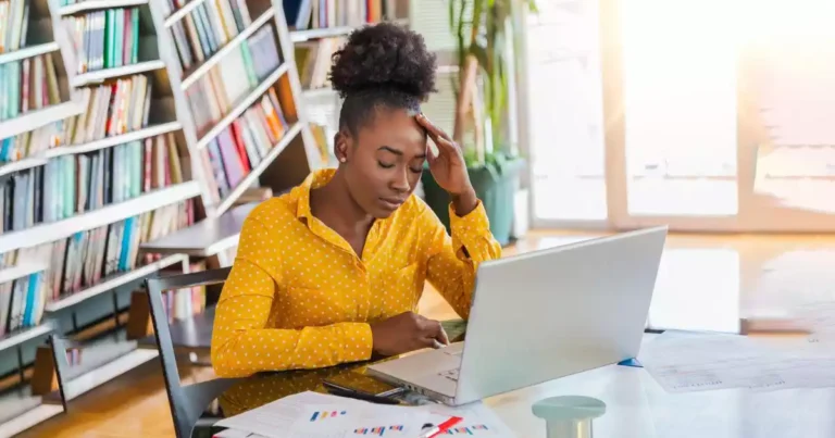Black person stressed in office - The BeniTalk